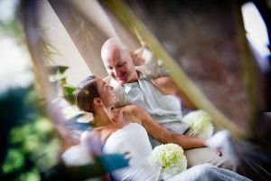 jennie and corey through the lead glass door